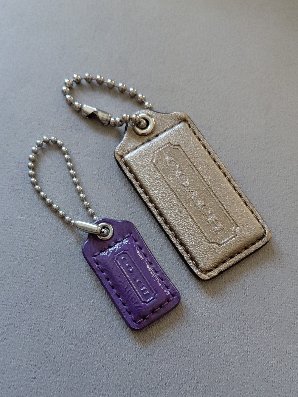 Coach Metallic Gold and Purple Leather Key Fob Duo